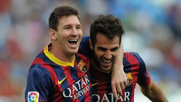 Fábregas, celebrando una anotación junto a Lionel Messi. (