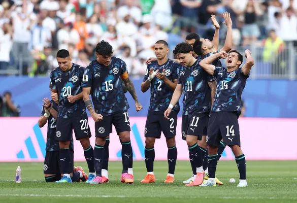 FOXBOROUGH, MASSACHUSETTS - JUNE 29: Paraguay players celebrate as Orlando Gill #12 of Paraguay saves the Germany's first penalty taken by Kai Havertz #7 (not pictured) during the penalty shootout during the FIFA World Cup 2026 Round Of 32 match between Germany and Paraguay at Boston Stadium on June 29, 2026 in Foxborough, Massachusetts. (Photo by Megan Briggs/Getty Images)