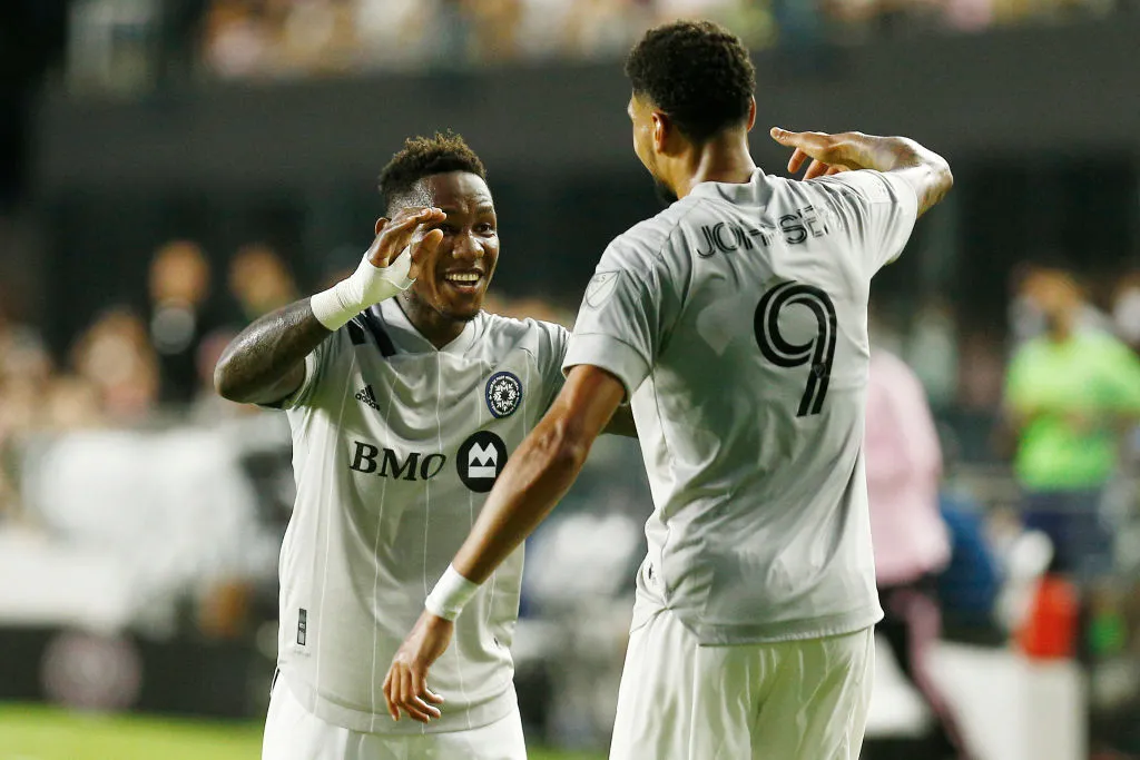 Romell Quioto celebrates Bjorn Johnsen of CF Montreal goal. (Photo by Michael Reaves/Getty Images)