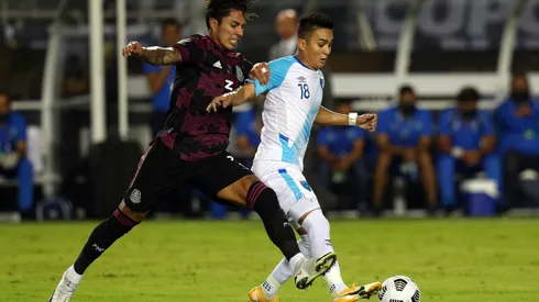 DALLAS, TEXAS - JULY 14: Carlos Salcedo #3 of Mexico and Robin Betancourth #18 of Guatemala fight for the ball in the first half at Cotton Bowl on July 14, 2021 in Dallas, Texas. (Photo by Richard Rodriguez/Getty Images)