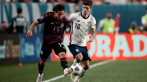 Jun 6, 2021; Denver, Colorado, USA; Mexico midfielder Diego Lainez (14) and United States forward Christian Pulisic (10) battle for the ball in extra time during the 2021 CONCACAF Nations League Finals soccer series final match at Empower Field at Mile High. Mandatory Credit: Isaiah J. Downing-USA TODAY Sports