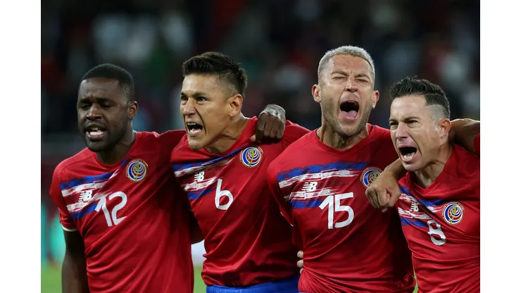 DOHA, QATAR - JUNE 14: Joel Campbell, Oscar Duarte, Francisco Calvo and Bryan Oviedo of Costa Rica sing their national anthem prior to the 2022 FIFA World Cup Playoff match between Costa Rica and New Zealand at Ahmad Bin Ali Stadium on June 14, 2022 in Doha, Qatar. (Photo by Mohamed Farag/Getty Images)