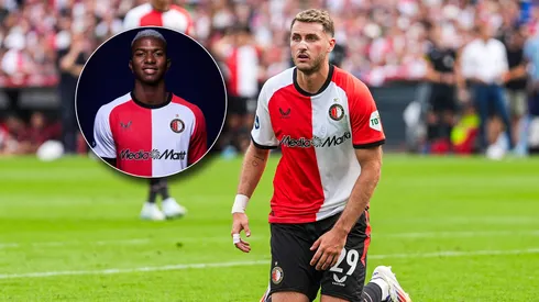 Santi Giménez se ve amenazado por Jeyland Mitchell en el Feyenoord.